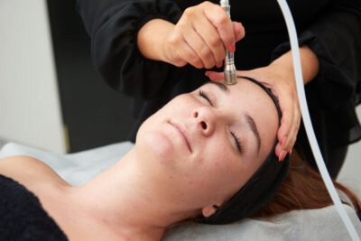 white hill clinic medispa patient model receiving microdermabrasion